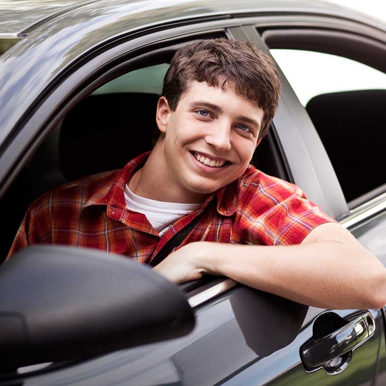 Young man in car with new auto glass installed by Northern Lites Autoglass in Manitoba