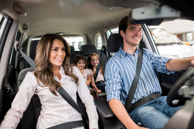 A family in Thompson riding in a car with auto glass services provided by Northern Lites Autoglass