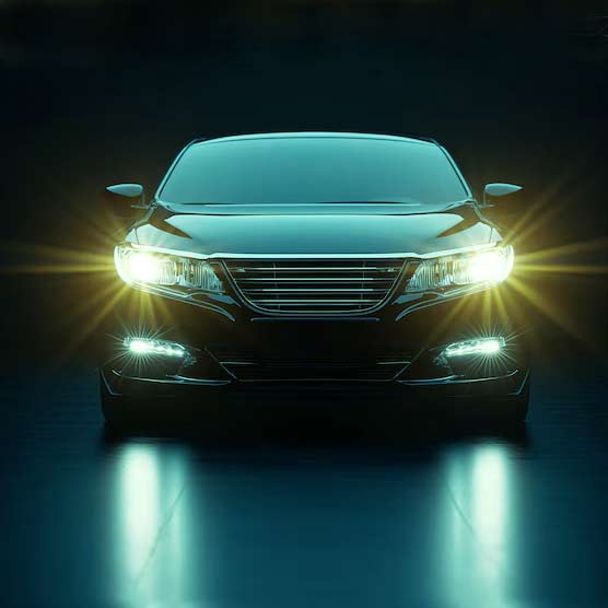 Front view of a car with headlights on